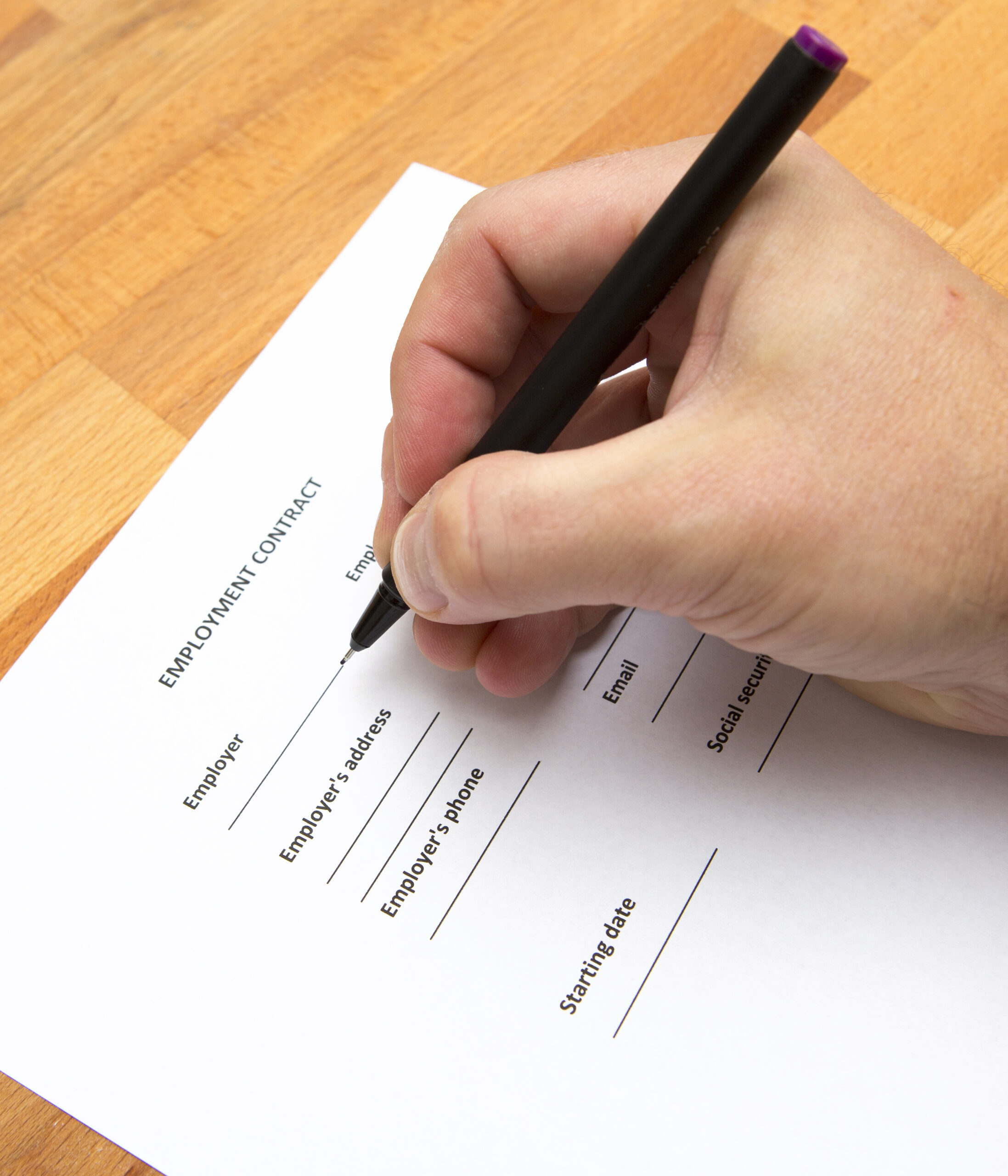 a-person-is-writing-an-employment-contract-blank-2025-10-10-11-25-18-utc