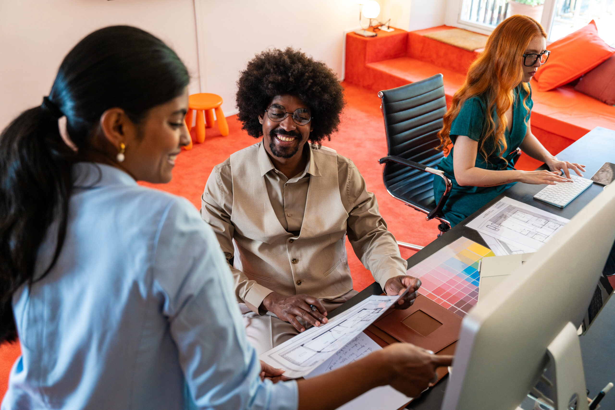 Multiethnic small group of businesspeople meeting in a coworking corporate company office - Young coworkers colleagues working together in a creative startup tech company, concepts about business and daily office lifestyle