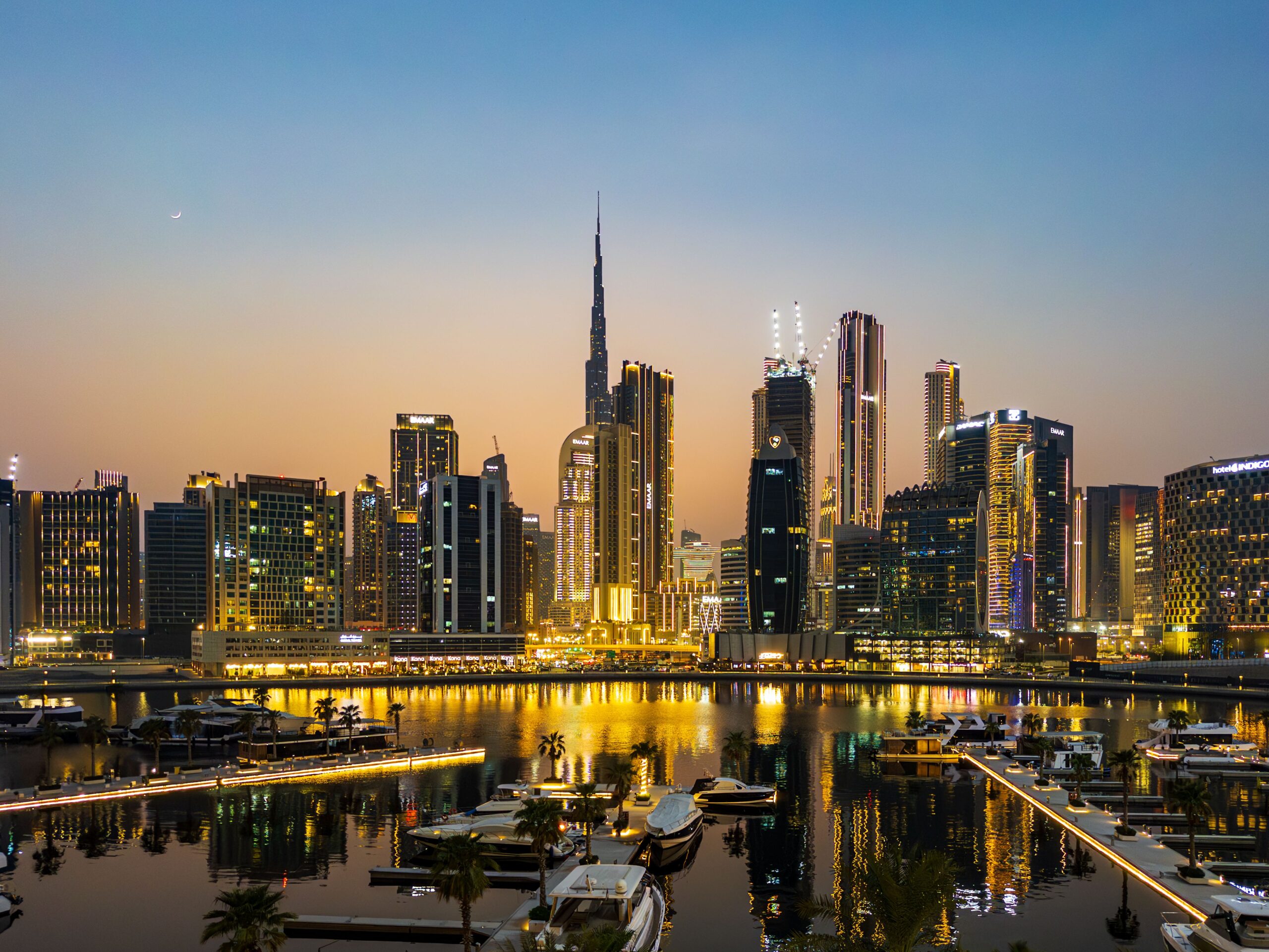 View of Dubai skyline including the Burj Khalifa, the world's tallest skyscraper as seen from Business Bay Marina in downtown Dubai