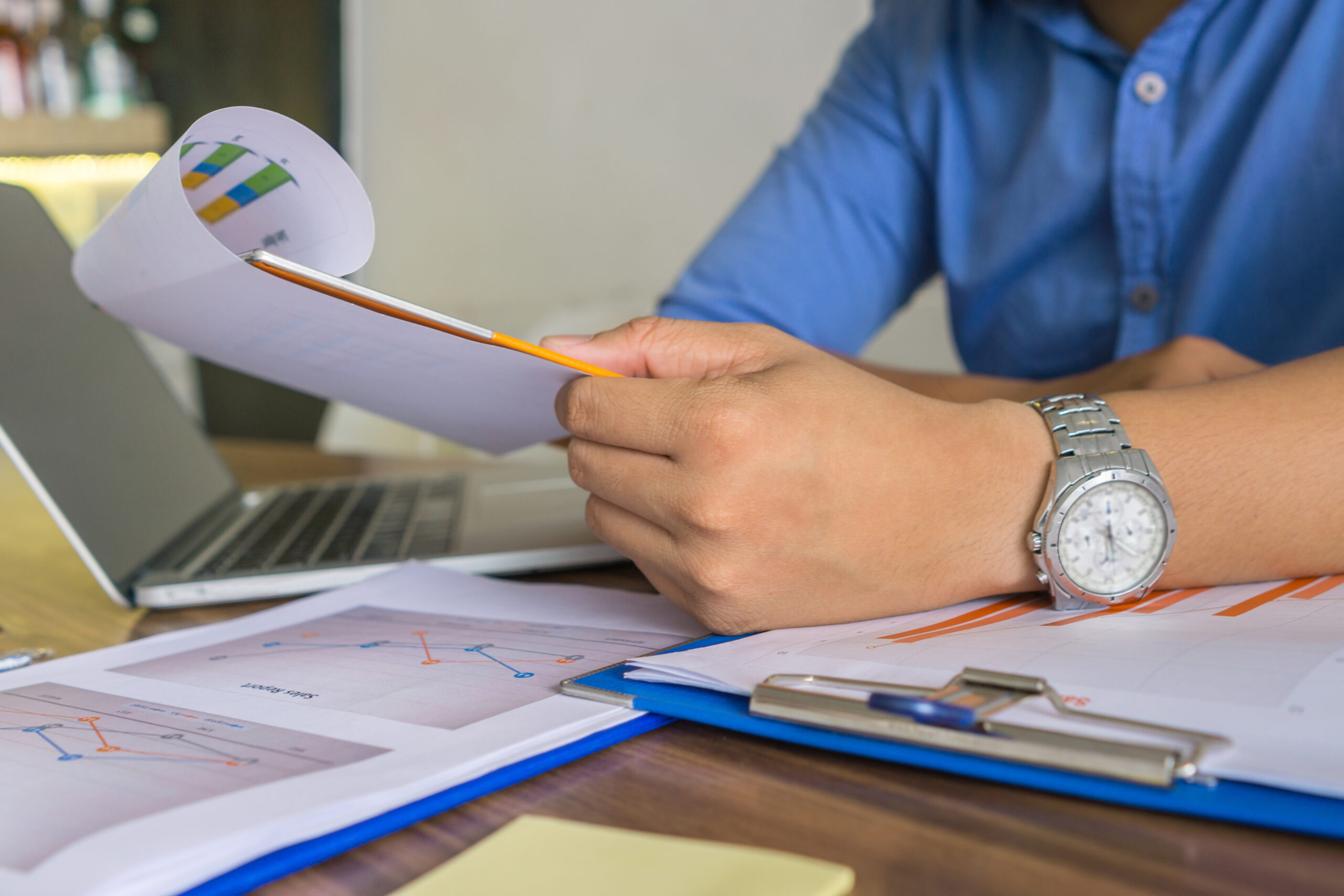 young-asian-businessman-reading-financial-report-d-2025-10-30-21-01-00-utc